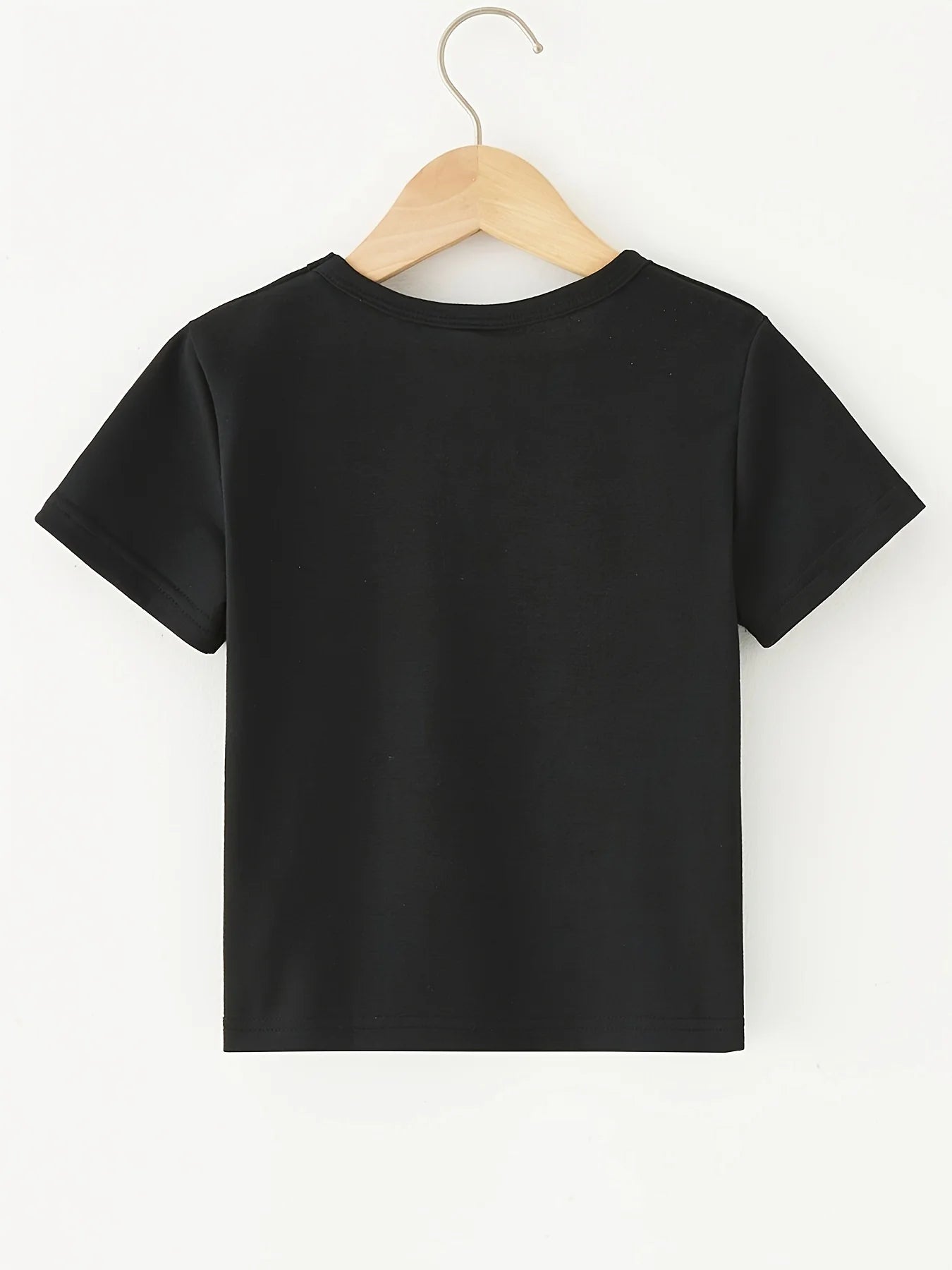A Young Boy Who Adores T-Shirts Featuring Dinosaurs